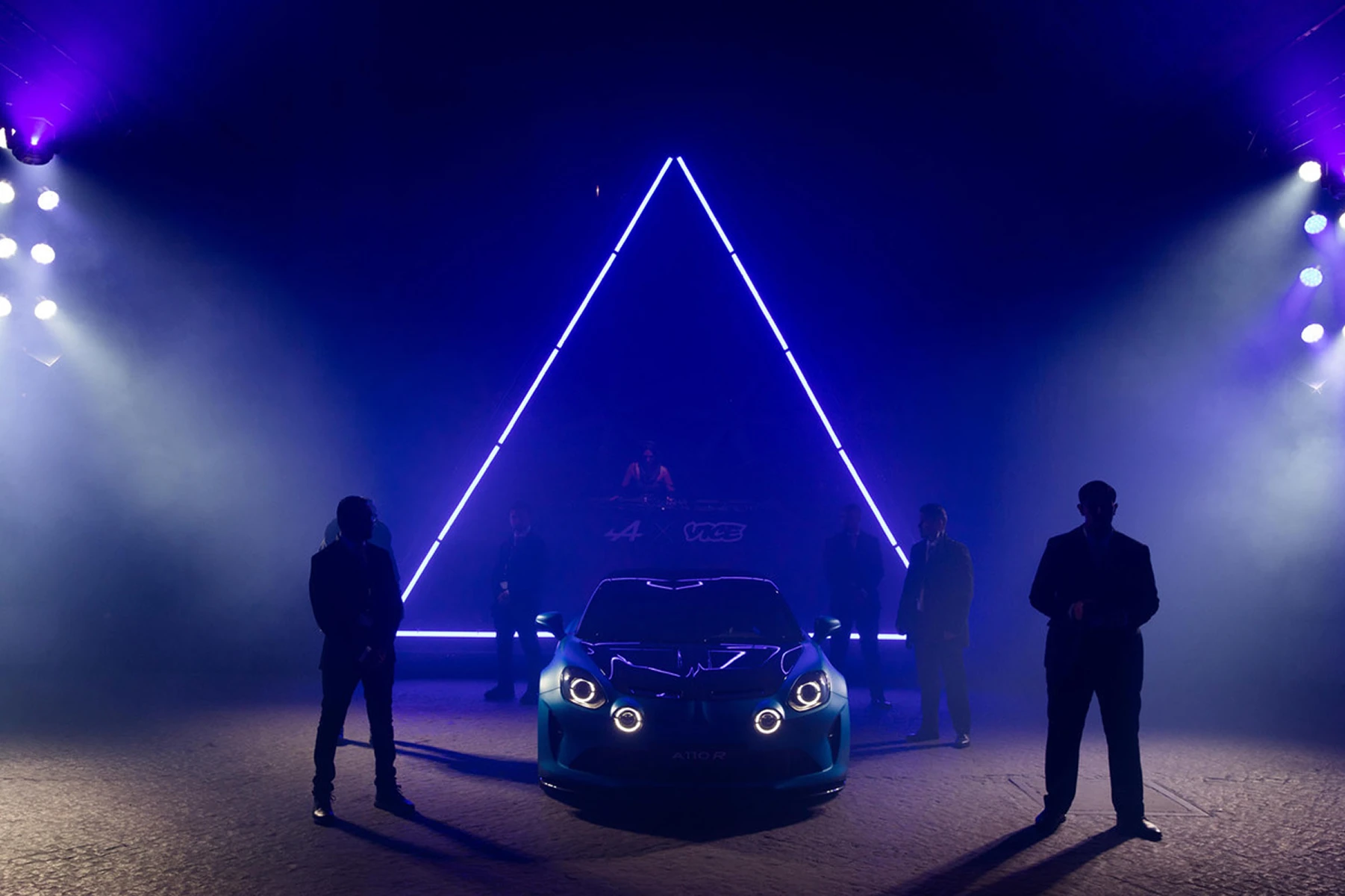 Illuminated triangular stage installation at the Alpine 'Die radikale Nacht' launch event, Berlin, Germany